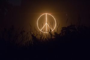 peace symbol in dark outdoors